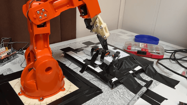 Figure 1 for Automating Internet of Things Network Traffic Collection with Robotic Arm Interactions