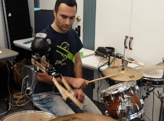 Figure 1 for User oriented assessment of vibration suppression by command shaping in a supernumerary wearable robotic arm