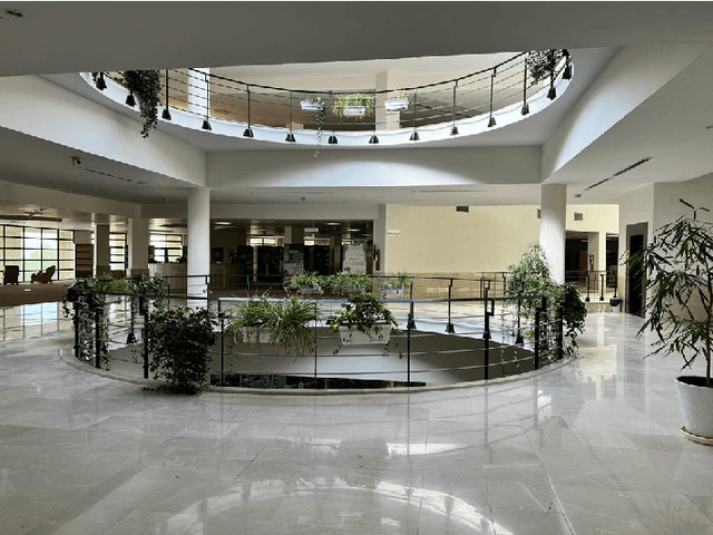 Figure 2 for Energy-Efficient Resource Allocation for Multi-IRS-Aided Indoor 6G Networks